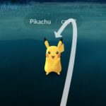 throwing pokeball towards pikachu