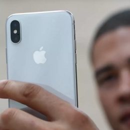 man snapping a portait mode with iphone x