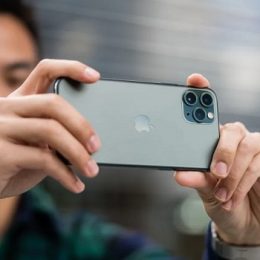 Man recording video on iPhone 11 Pro