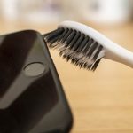 cleaning iPhone microphone with a toothbrush