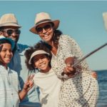 family capturing a selfie with a stick
